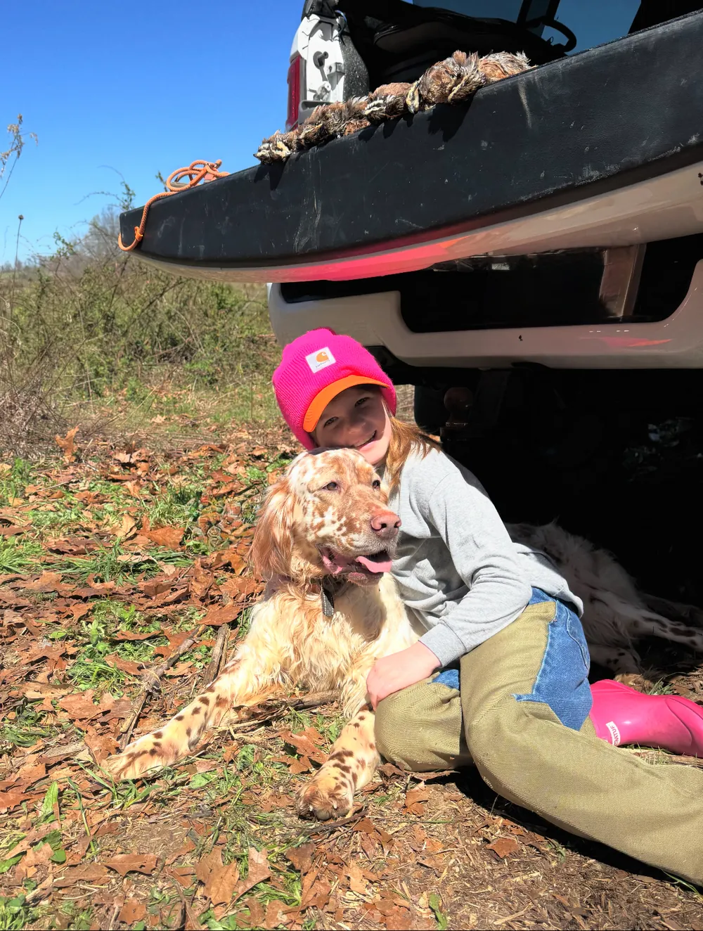 A young hunter with one of the Blue Ridge setters after a hunt